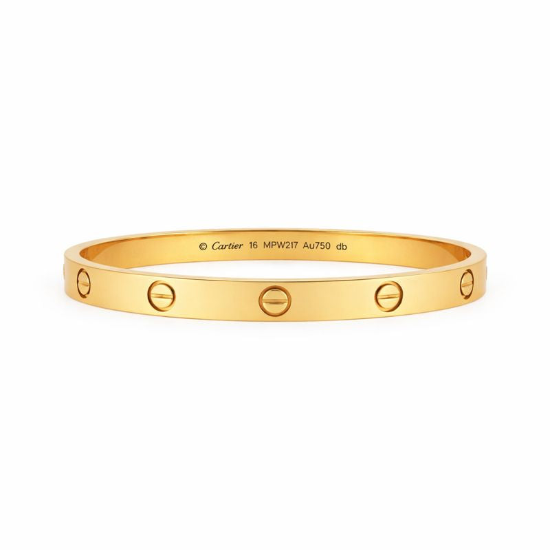 Gold bracelet with Cartier logo on a white background